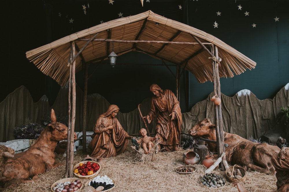 Vintage nativity scene with Mary, Joseph, baby Jesus, cows