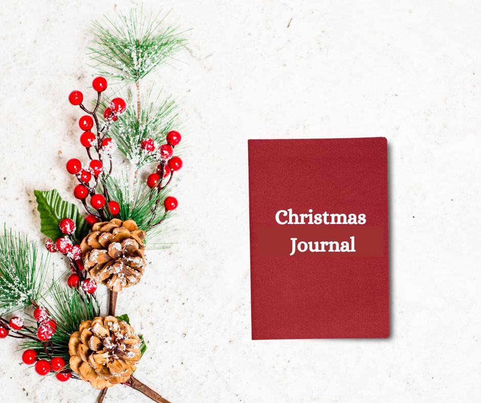 Christmas holly and red Christmas journal.