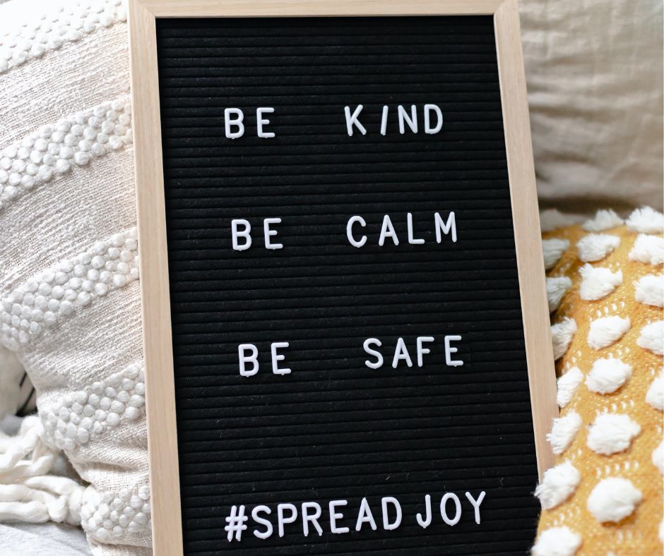 Sign with Be kind, be calm, be safe, spread joy to reflect random acts of kindness.