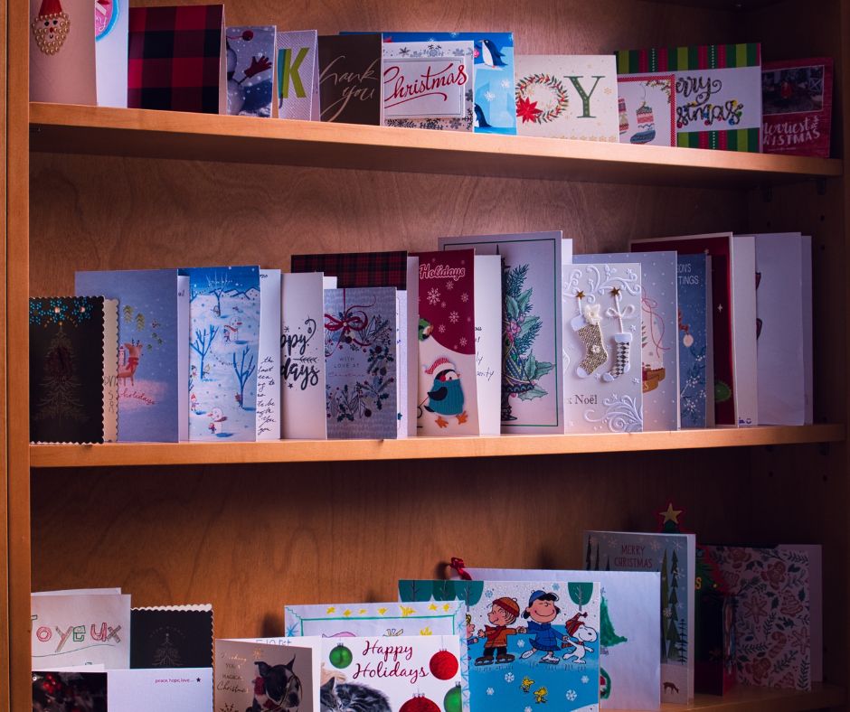 Bookshelf lined with various Christmas cards
