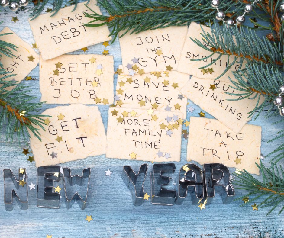 Beige cards with various new year's resolutions written.