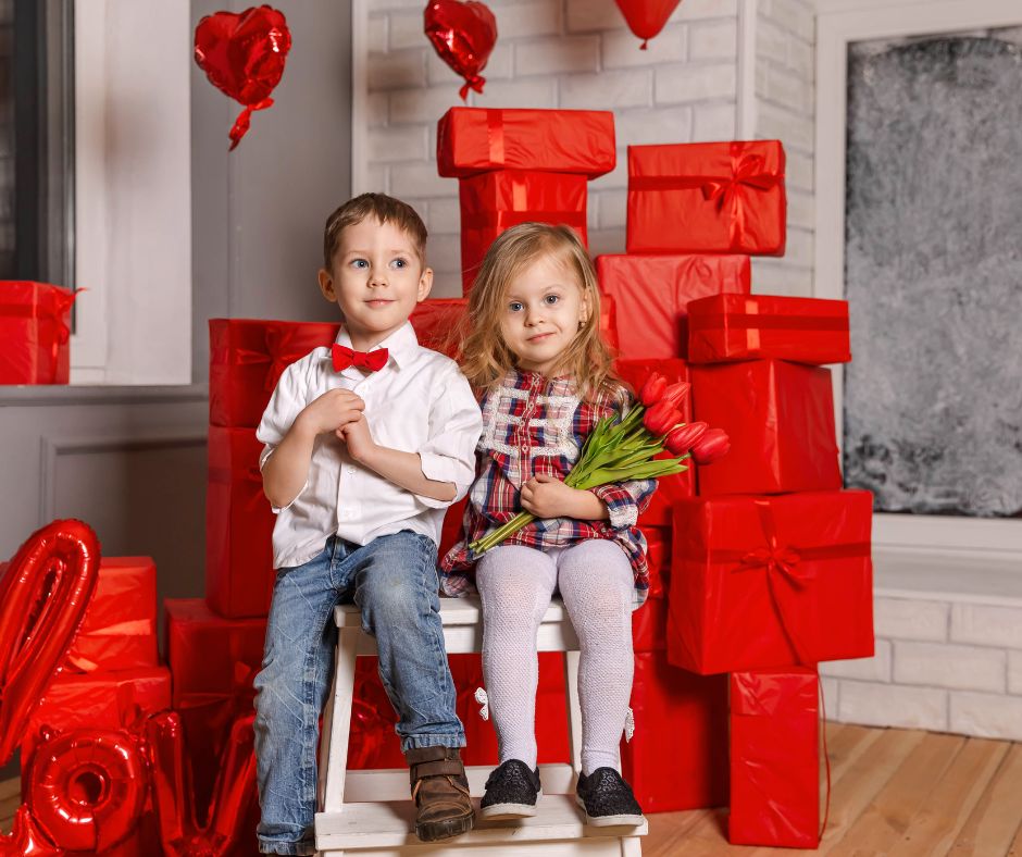 Boy and girl sitting on bench on porch with Valentine's Day presents.