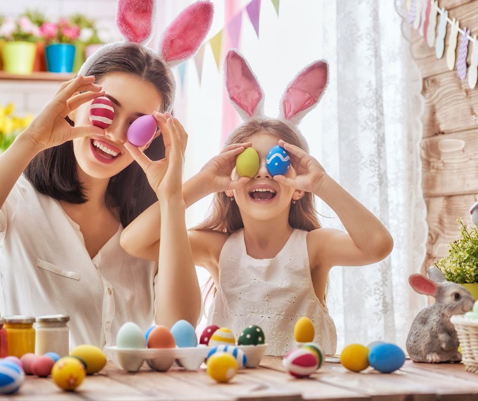 Mother and daughter enjoying one of the Easter activities decorating eggs.