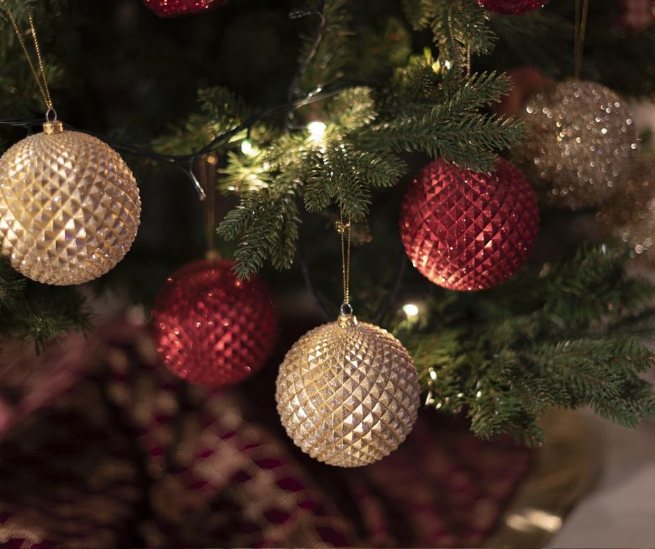 Red and gold Christmas balls hanging on a tree