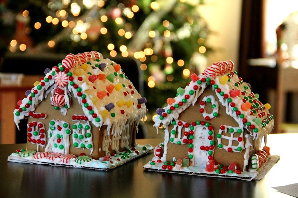 Two gingerbread houses on a table.