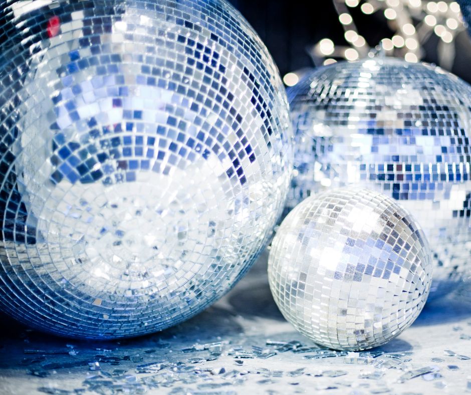 Three disco balls to show one of Christmas party themes.