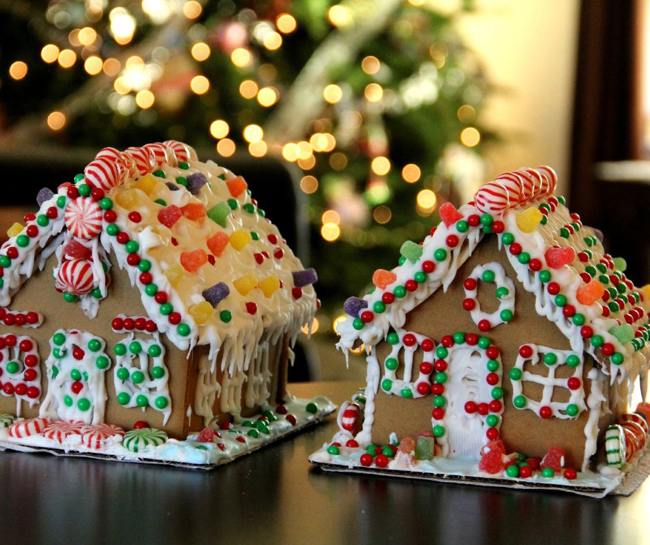 Two gingerbread houses on a table.