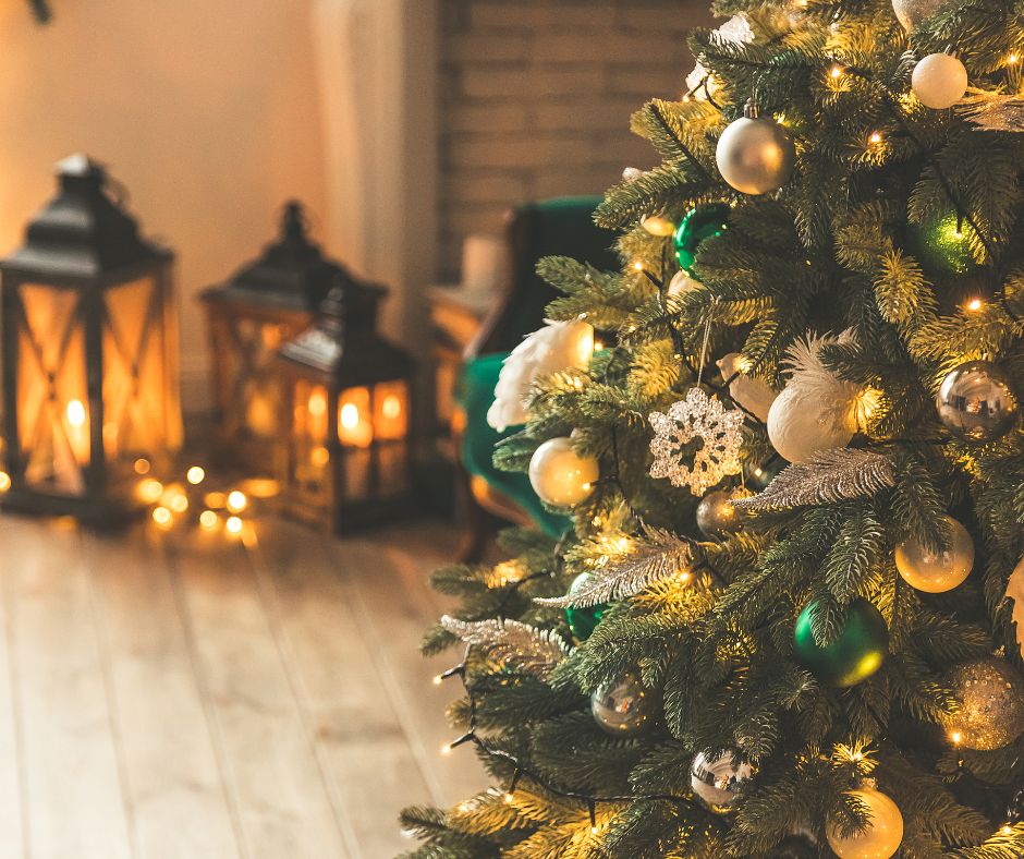 Decorated Christmas tree with gree and gold balls.