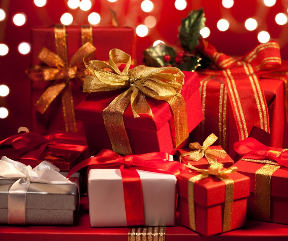 Several wrapped presents in gold and red. 