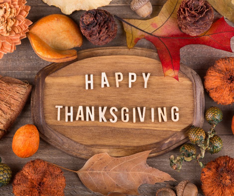 Happy Thanksgiving written on cutting board to depict Thanksgiving gratitude.