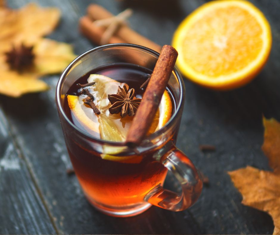 Glass of mulled wine with cinnamon stick